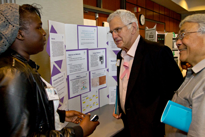 Bruce Alberts and Vice Chancellor Keith Yamamoto review a student's work. Bruce Alberts and Vice Chancellor Keith Yamamoto review a student's work.