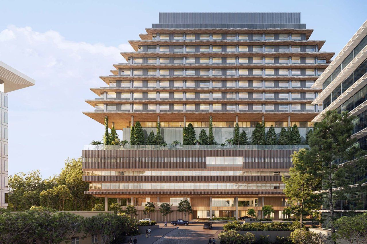 The terraced hospital has a floor in the middle with trees and balcony views