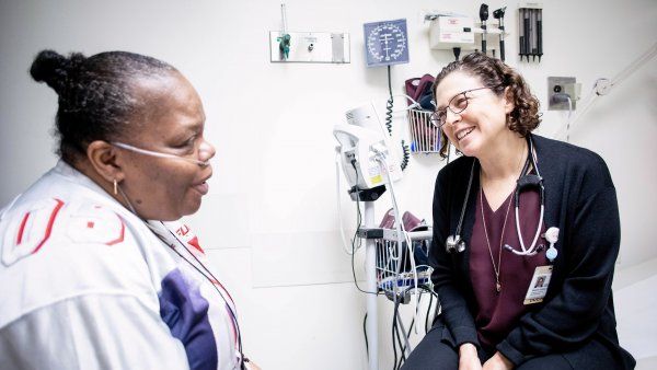 doctor talks with a patient