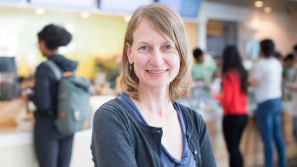 Woman standing in front of cafe counter