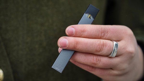 Hand holding JUUL