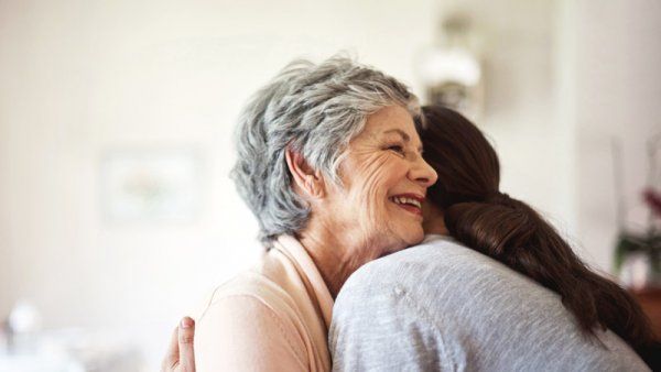 women hugging.