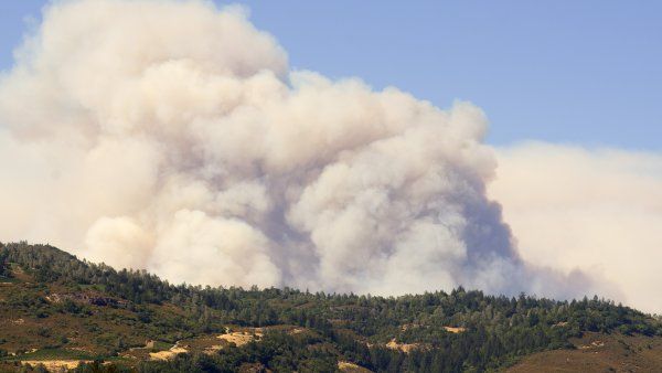 smoke fills the sky from a wildfire