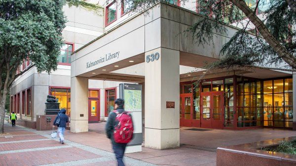 a person walks past Parnassus library