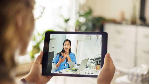 doctor does telemedicine call on iPad