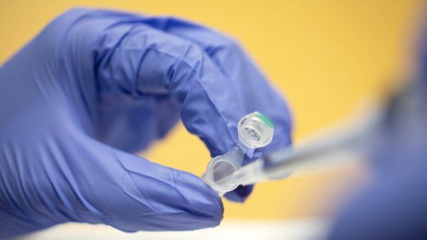 pipetting into a test tube in a UCSF lab