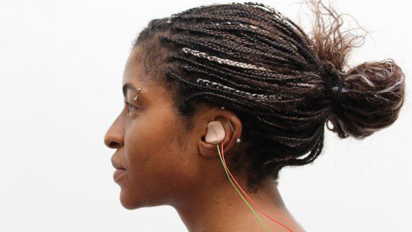 woman wears an earbud