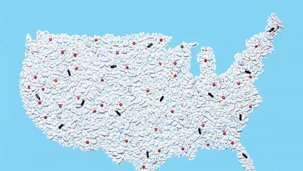 Photo illustration of a map of the United States, made out of pills; most of the pills are white, with only a few black and red pills.