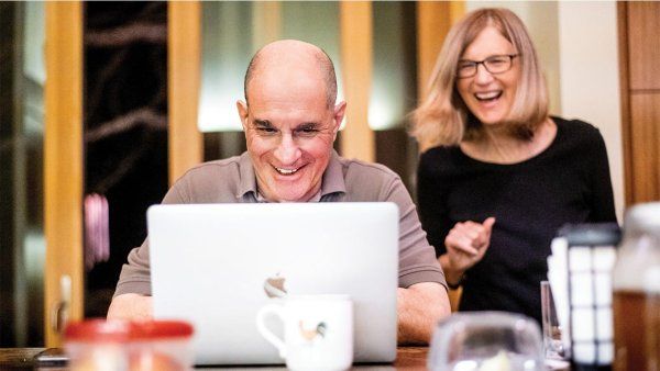 David Julius, and his wife, Holly Ingraham, field congratulatory calls in the early morning of October 4 from their home in Walnut Creek.