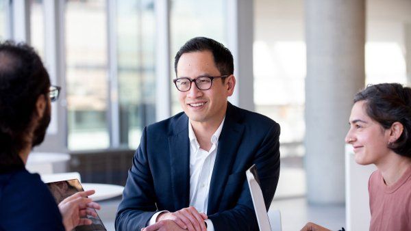 Neurosurgeon Edward Chang meeting with graduate student Ilina Bhaya-Grossman and David Moses, PhD