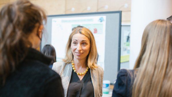 Natalia Jura speaks with guests at the Byers Lecture