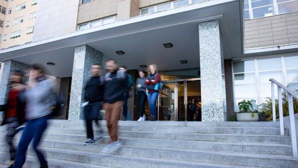 Students walking out of a medical building at the Parnassus campus.