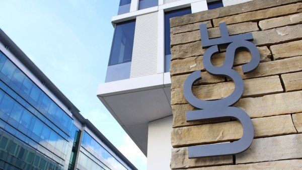 A wall of a building in Mission Bay with "UCSF" signagge mounted