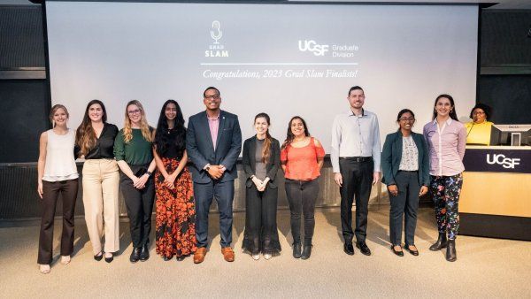 Grad Slam finalists on stage in front of a screen that reads "Congratulations, 2023 Grad Slam Finalists!"