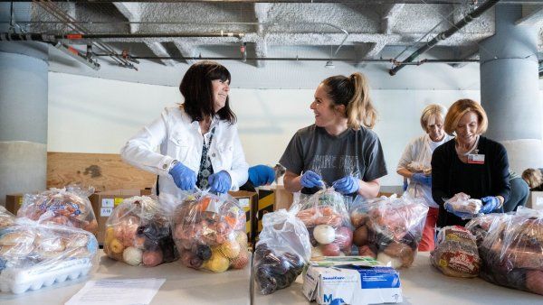 Volunteers packing food