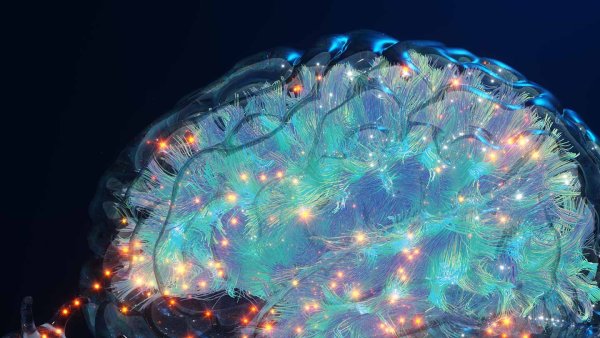 A 3D rendering of platelets releasing PF4 as orange glowing cells into a glassy brain.