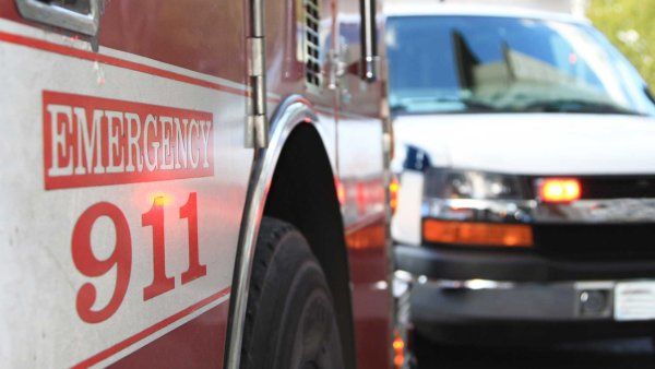 An emergency scene with an ambulance and a fire engine.