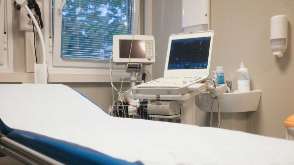 An ultrasound machine and an examination bed at a clinic.