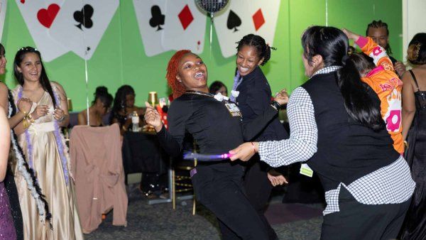 Patients and staff at U C S F Benioff Children's Hospital, Oakland smile as the dance on the dance floor.