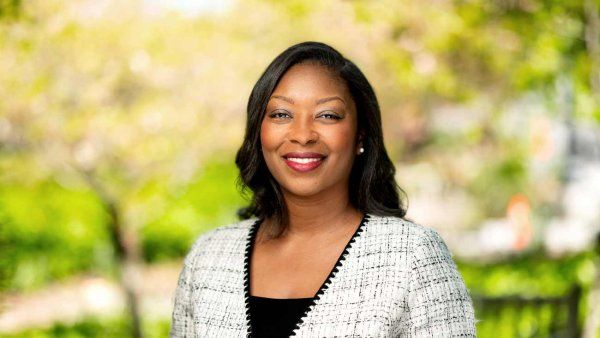 Headshot of Darnele Wright among an outdoor background with trees.