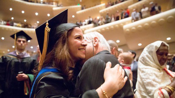 School of Medicine graduate Hengameh Zahed receives a hug during the commencement ceremony.