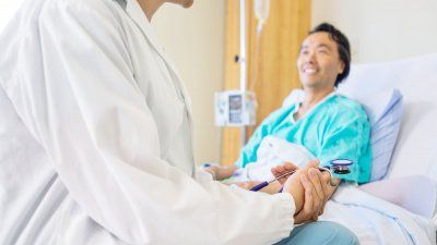 asian-man-patient-hospital-bed.jpg