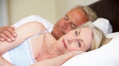 couple-sleeping-woman-awake.jpg