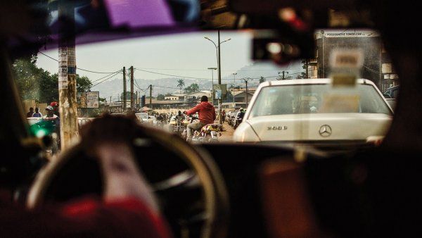 Hands on the car's steering wheel