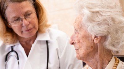senior_woman_with_doctor.jpg