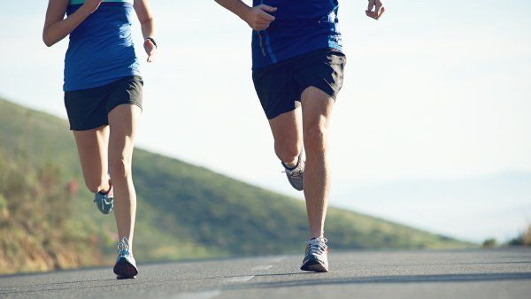 Two people out jogging. 