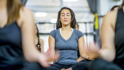 woman-meditating-group-setting.jpg